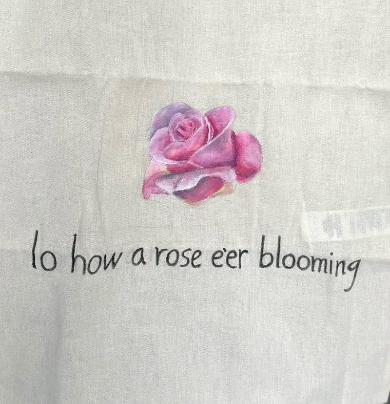 Close-up of the single painted rose.